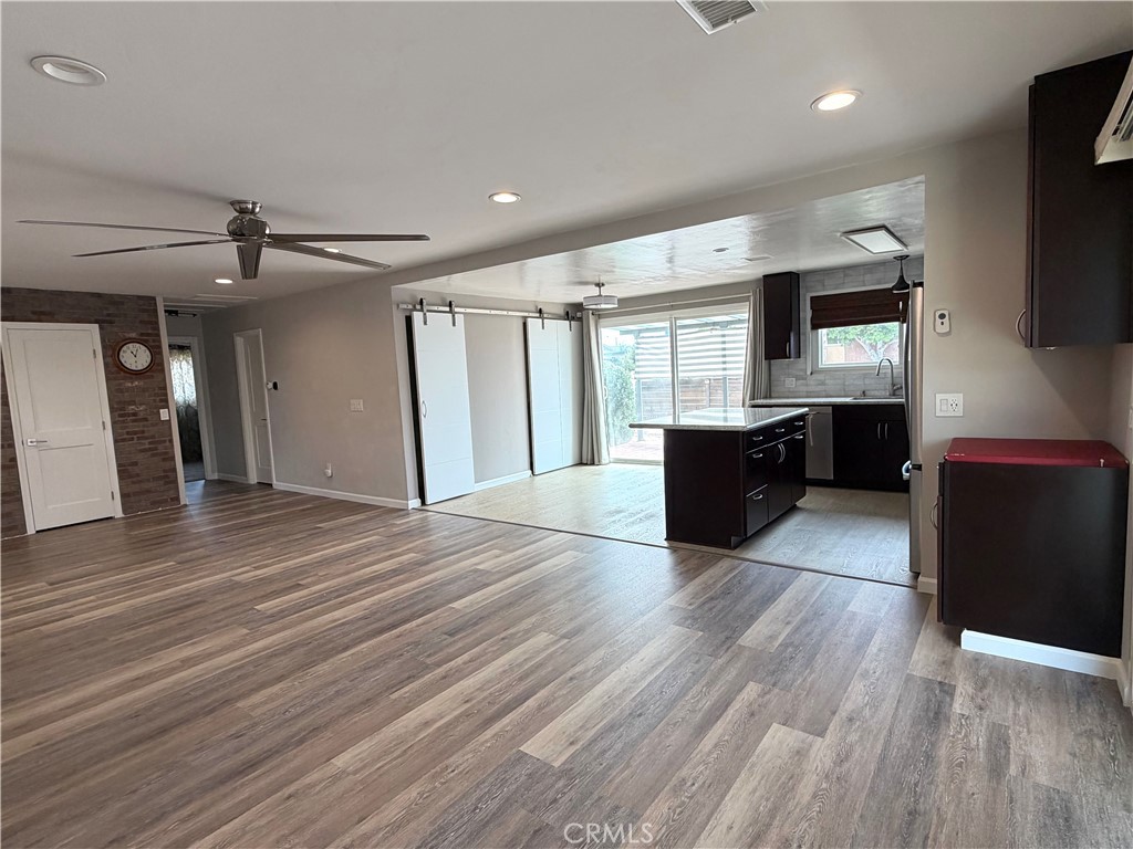 8657 Rumson Drive Santee, CA 92071 - Photo 19 of 65 a living room with stainless steel appliances kitchen island granite countertop furniture and a kitchen view