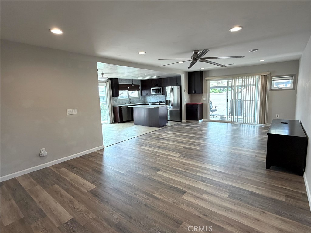 8657 Rumson Drive Santee, CA 92071 - Photo 22 of 65 a view of a kitchen with wooden floor and a fireplace