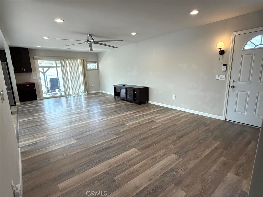 8657 Rumson Drive Santee, CA 92071 - Photo 23 of 65 an empty room with wooden floor and fireplace