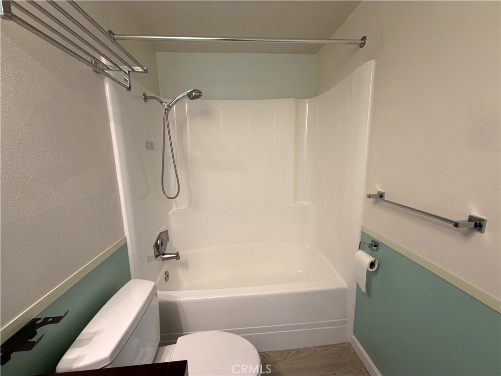 8657 Rumson Drive Santee, CA 92071 - Photo 27 of 65 a bathroom with a toilet bathtub vanity and shower