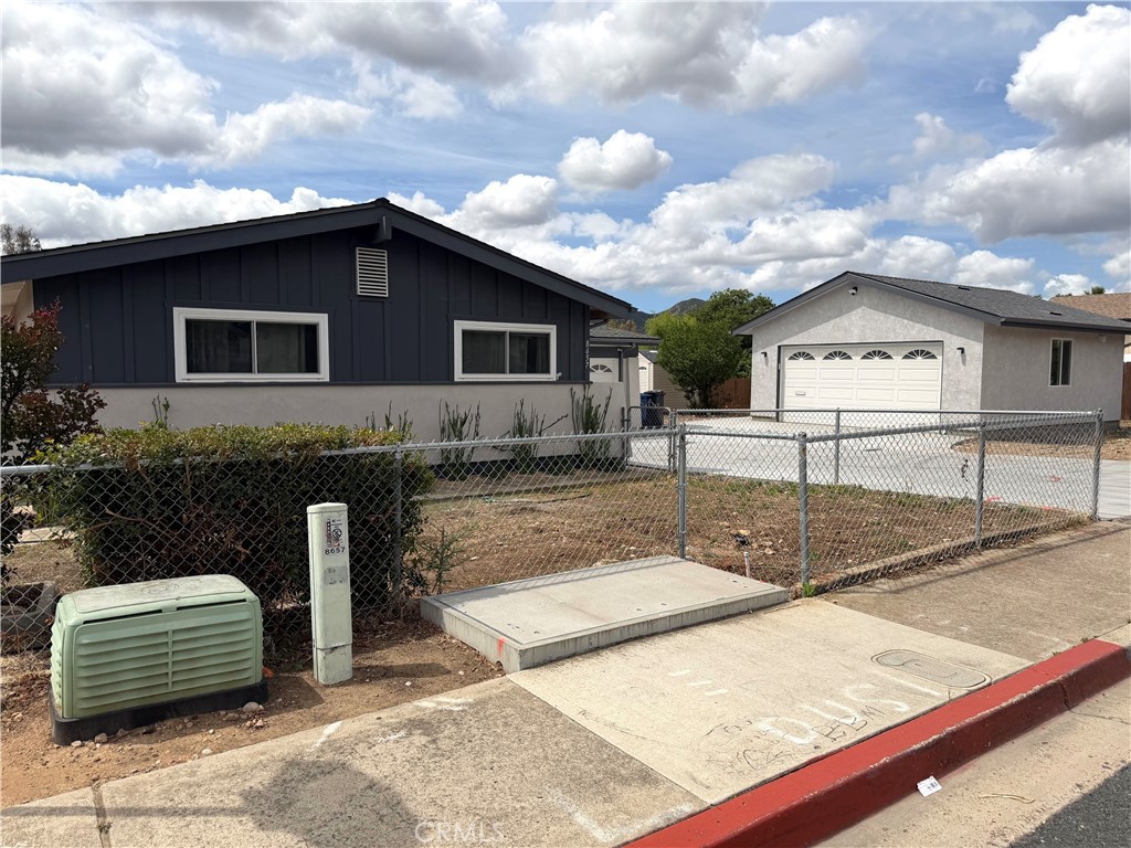 8657 Rumson Drive Santee, CA 92071 - Photo 3 of 65 chain link fenced for maximum security and privacy