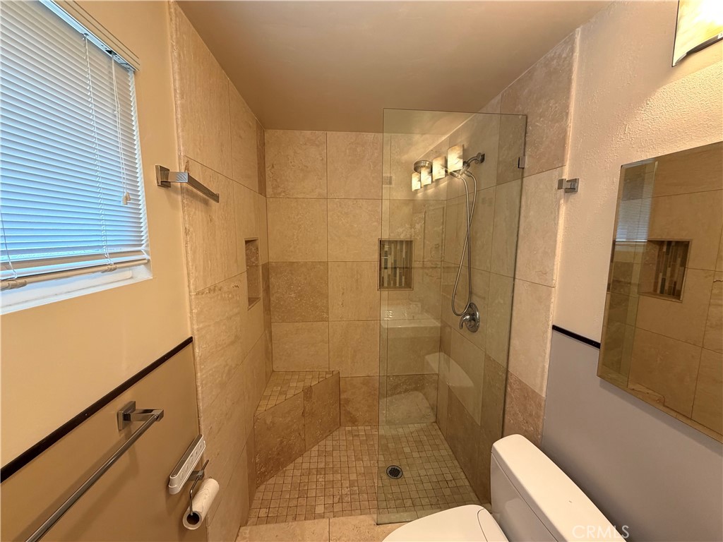 8657 Rumson Drive Santee, CA 92071 - Photo 36 of 65 a bathroom with a shower and a toilet
