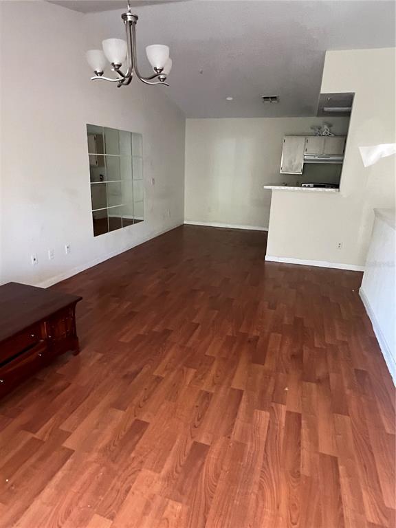4312 South Kirkman Road, Unit 1404 Orlando, FL 32811 - Photo 2 of 5 a view of a room with wooden floor and ceiling fan