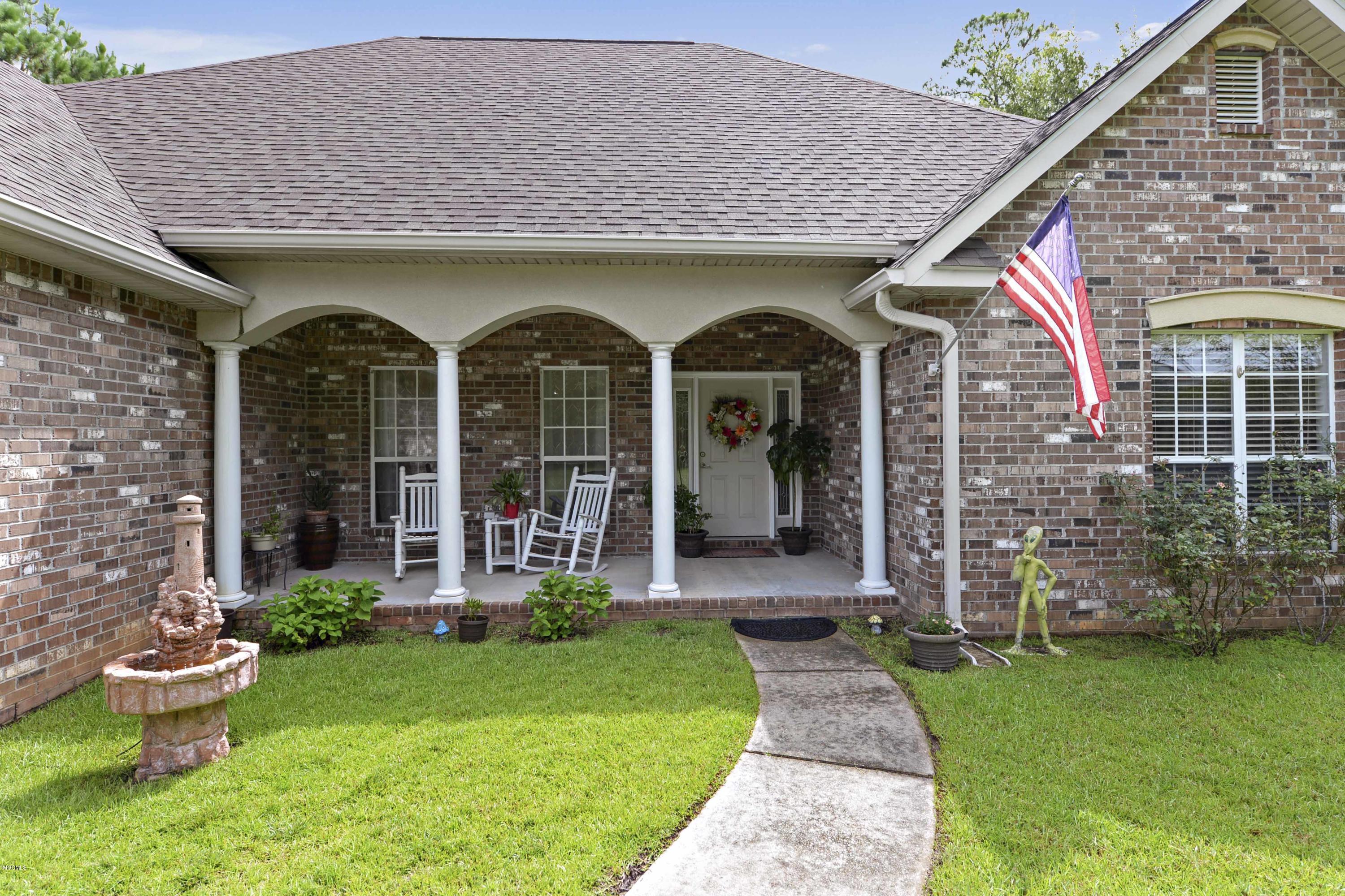 6428 Poco Road Ocean Springs, MS 39564 - Photo 1 of 28 front porch