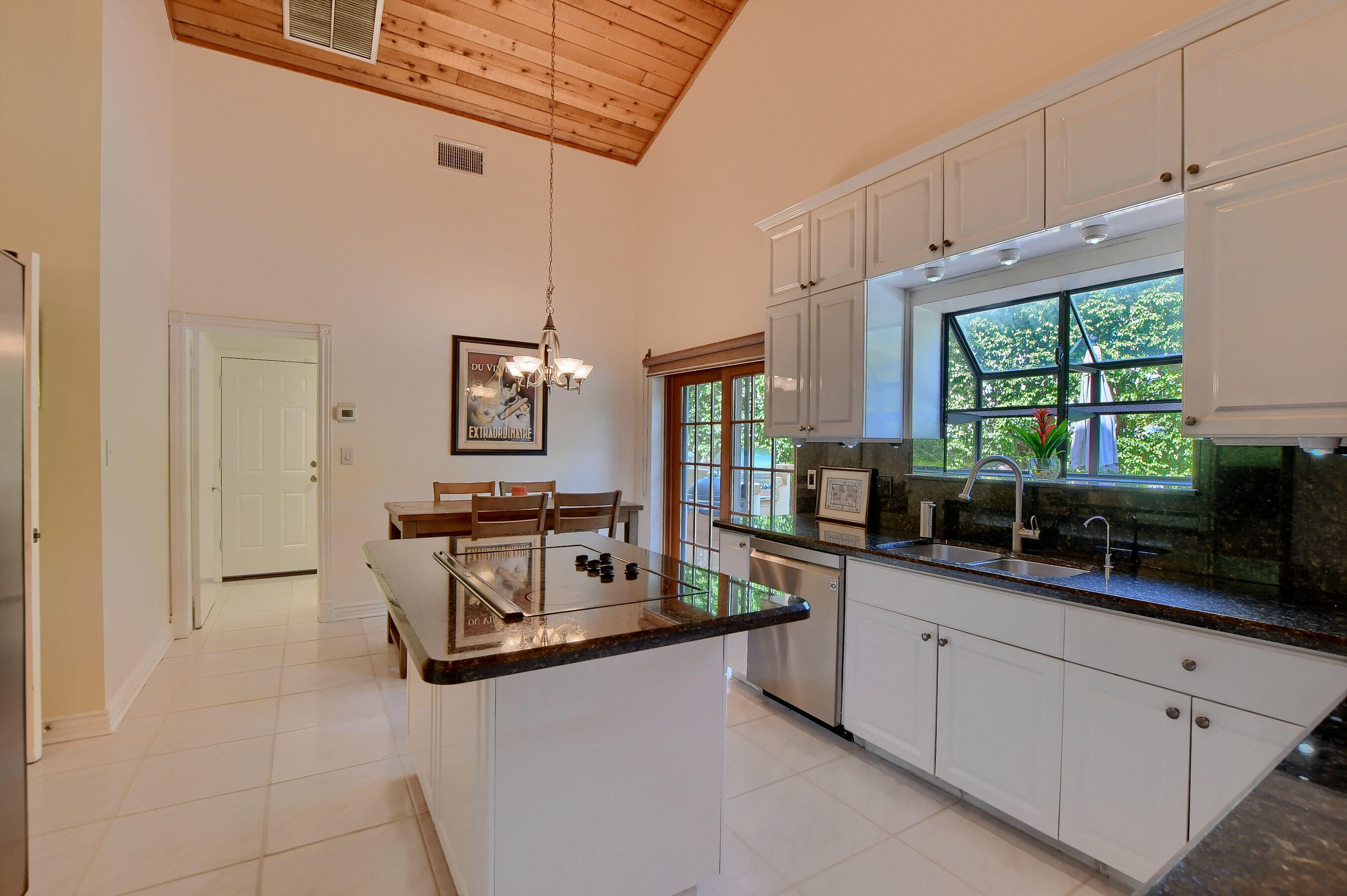 2845 Northwest 42nd Street Boca Raton, FL 33434 - Photo 15 of 60 a kitchen with stainless steel appliances granite countertop a sink and cabinets