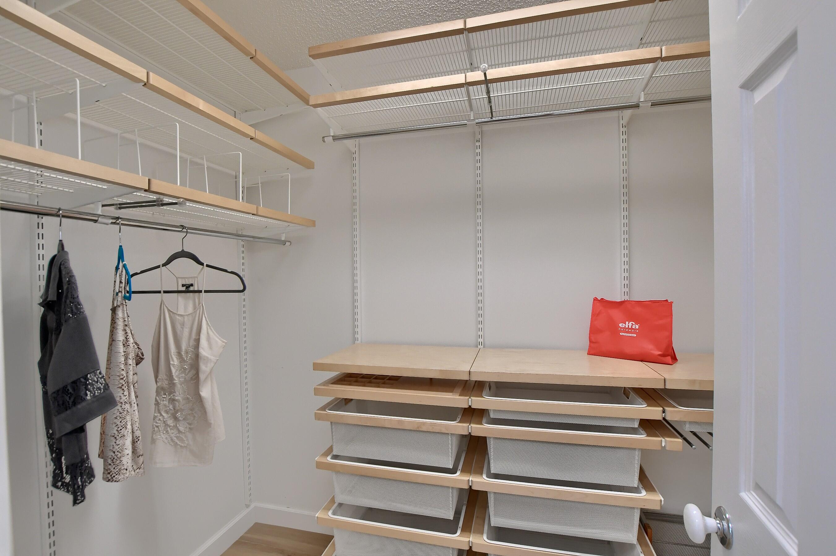 2845 Northwest 42nd Street Boca Raton, FL 33434 - Photo 34 of 60 a view of walk in closet with clothes and shoes