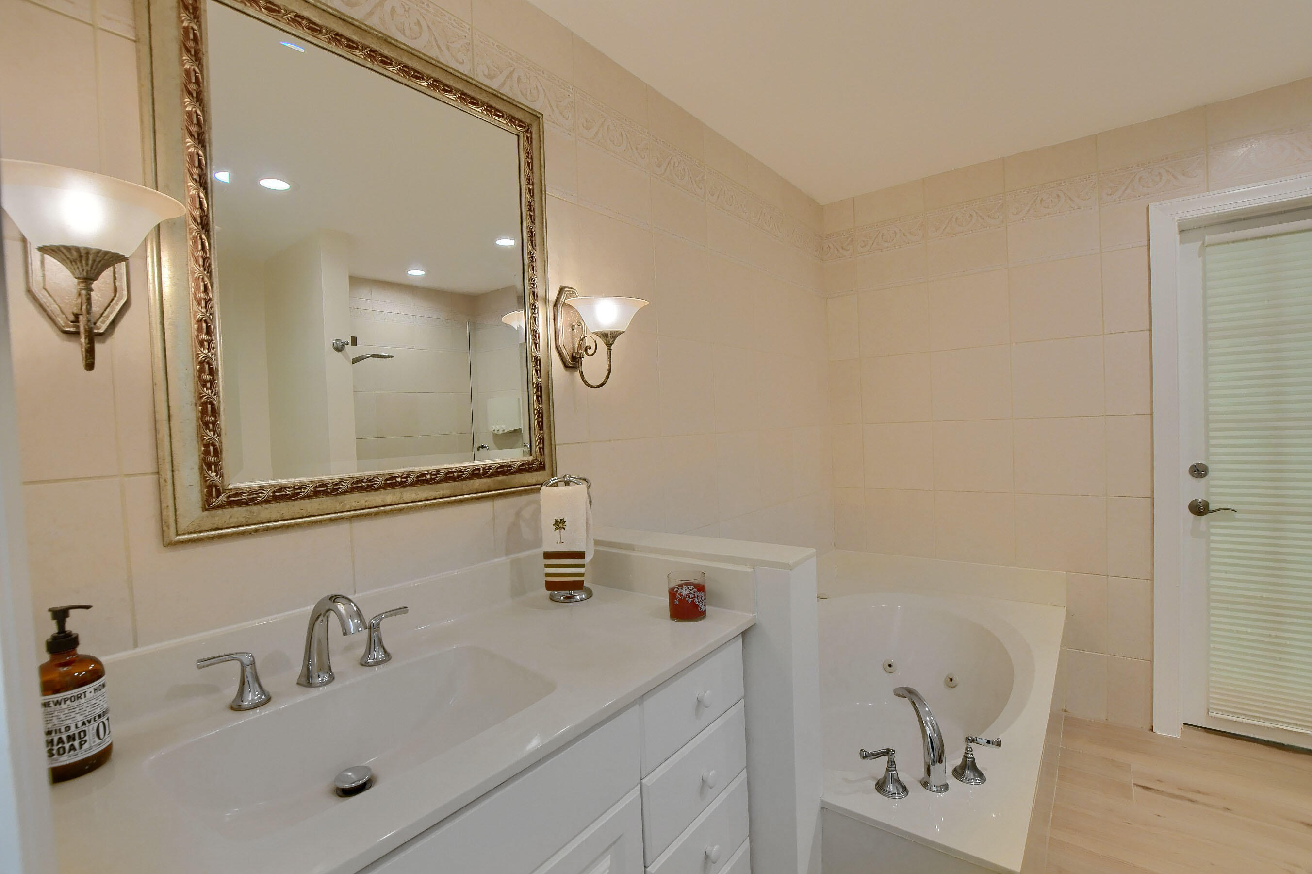 2845 Northwest 42nd Street Boca Raton, FL 33434 - Photo 36 of 60 a bathroom with a sink a toilet and shower