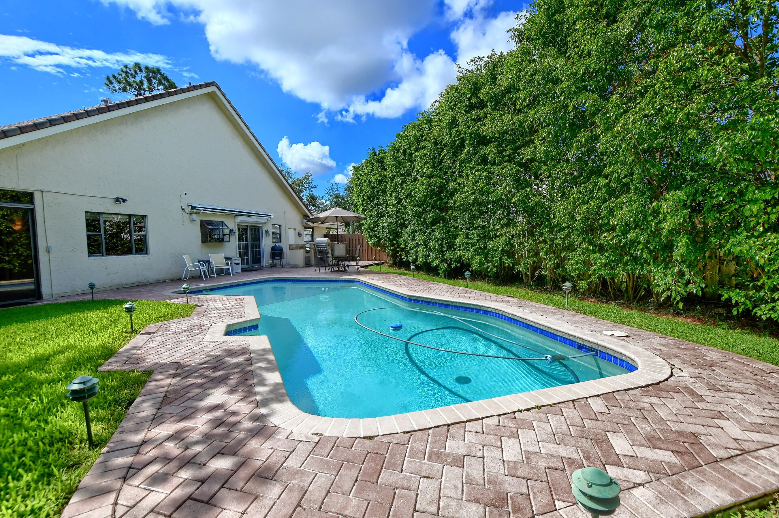 2845 Northwest 42nd Street Boca Raton, FL 33434 - Photo 47 of 60 a view of outdoor space yard swimming pool and porch