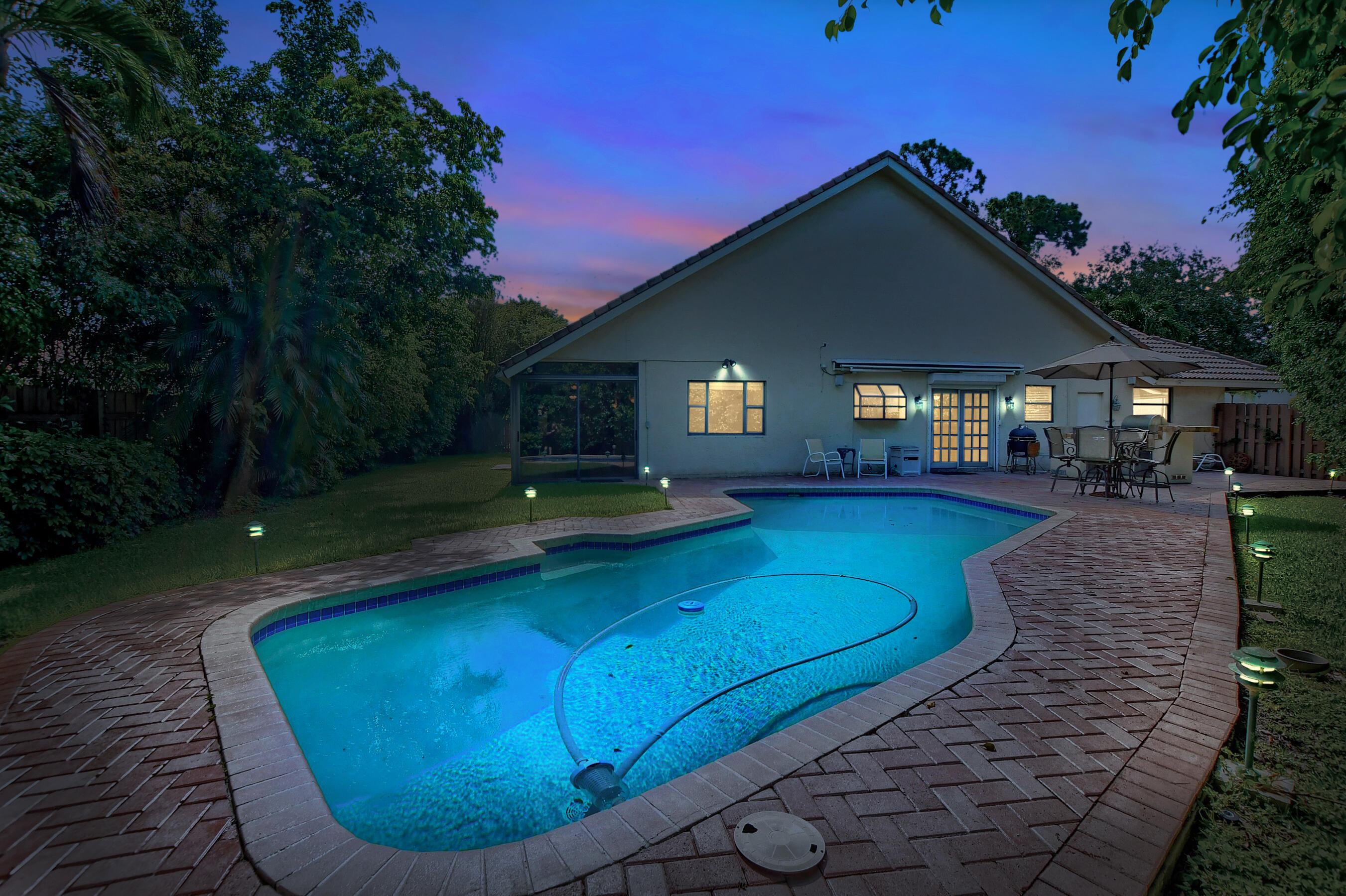 2845 Northwest 42nd Street Boca Raton, FL 33434 - Photo 48 of 60 a view of a house with swimming pool and yard