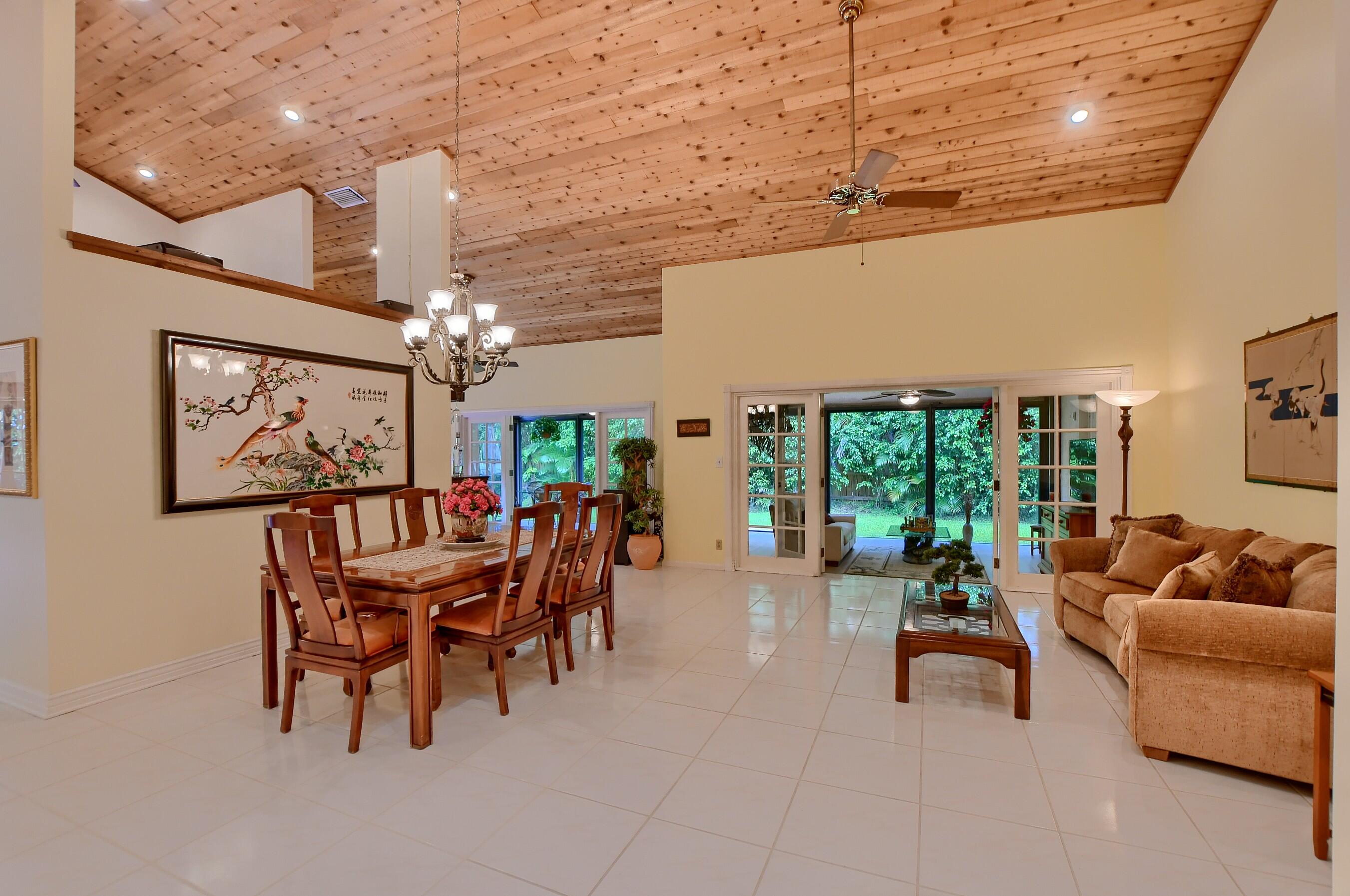 2845 Northwest 42nd Street Boca Raton, FL 33434 - Photo 6 of 60 a living room with furniture and a chandelier
