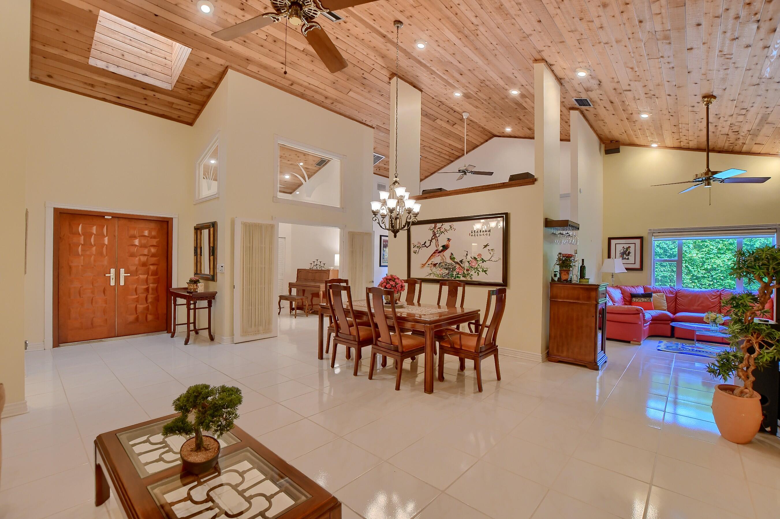 2845 Northwest 42nd Street Boca Raton, FL 33434 - Photo 10 of 60 a dining room with furniture and a chandelier