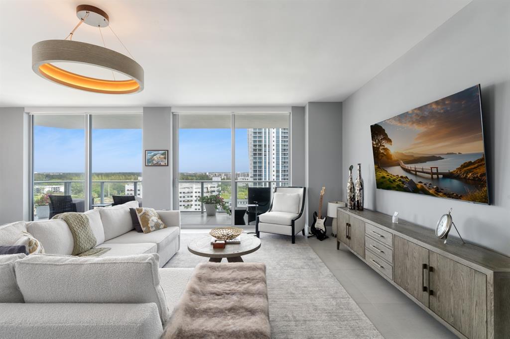 17111 Biscayne Boulevard, Unit 1101 North Miami Beach, FL 33160 - Photo 11 of 43 a living room with furniture and a flat screen tv