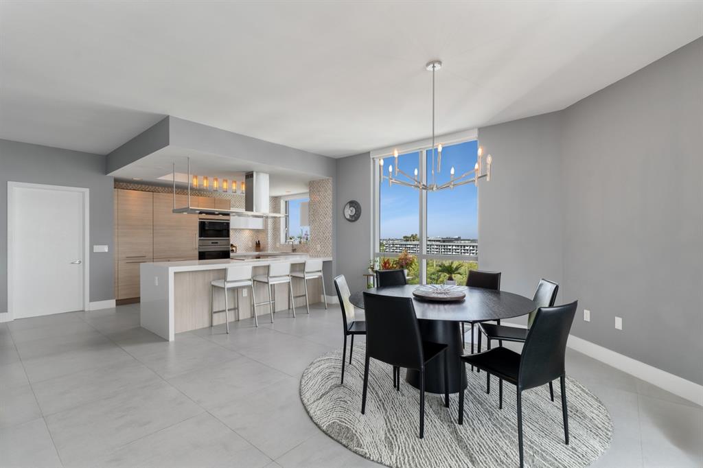 17111 Biscayne Boulevard, Unit 1101 North Miami Beach, FL 33160 - Photo 13 of 43 a view of a dining room with furniture window and outside view