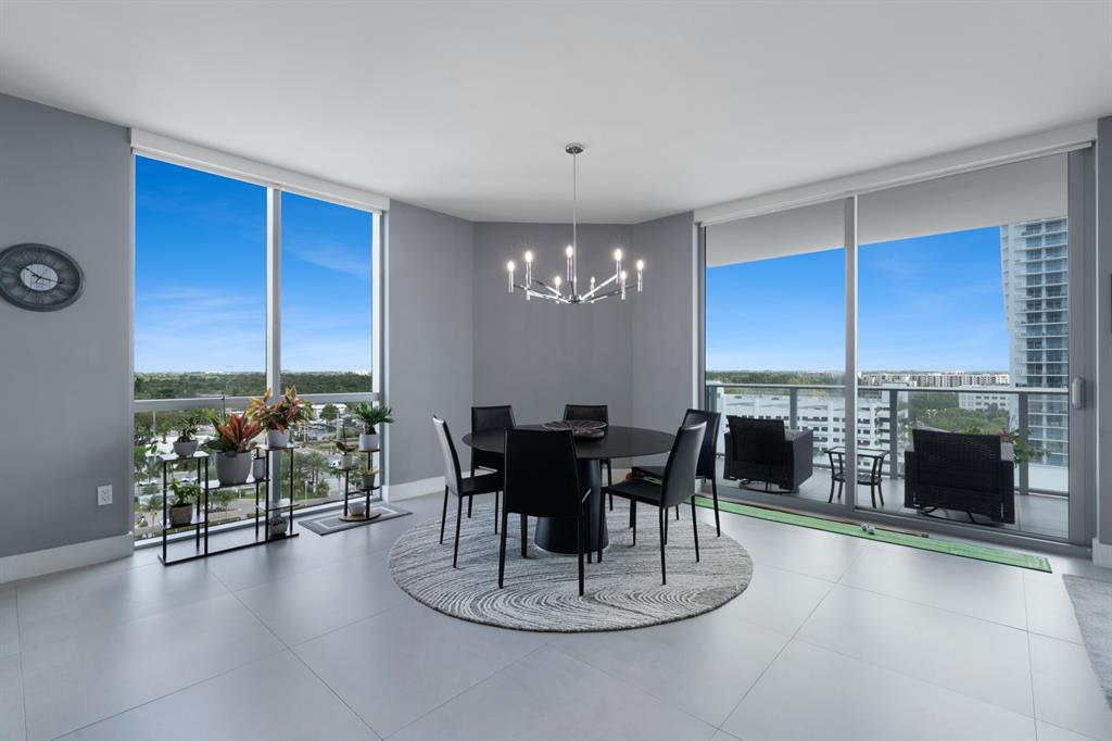 17111 Biscayne Boulevard, Unit 1101 North Miami Beach, FL 33160 - Photo 14 of 43 a dining room with furniture fireplace and a window