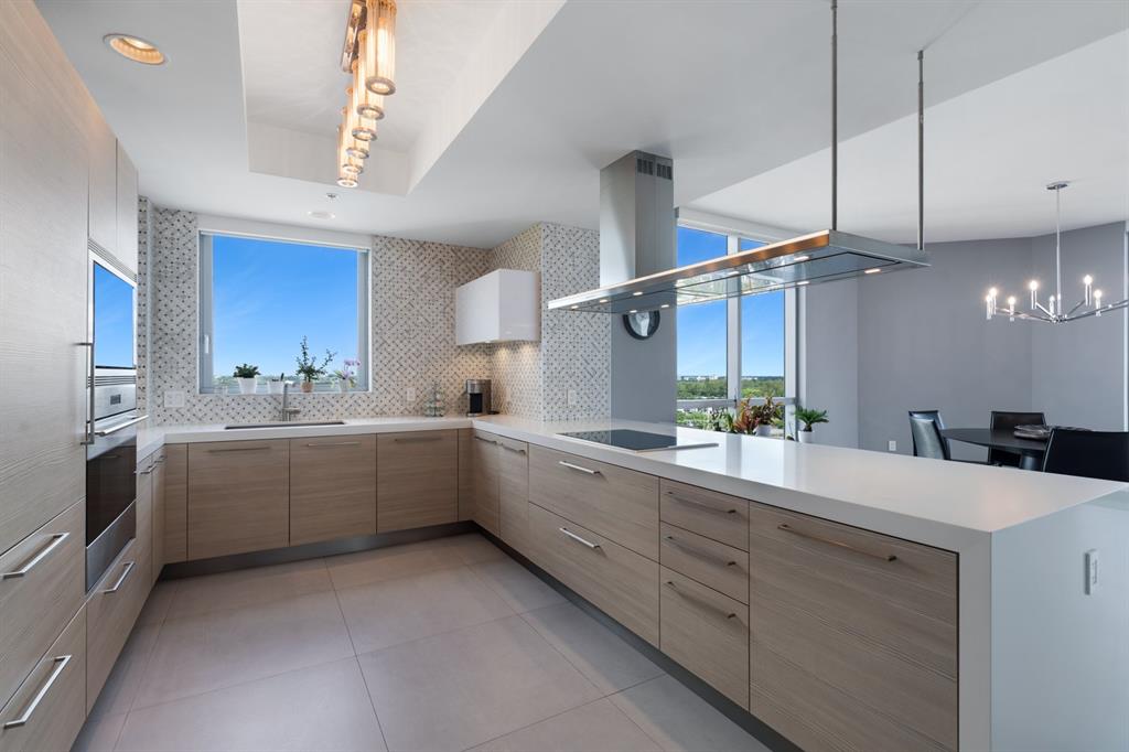 17111 Biscayne Boulevard, Unit 1101 North Miami Beach, FL 33160 - Photo 16 of 43 a kitchen with sink and cabinets