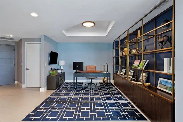 a view of a workspace with furniture