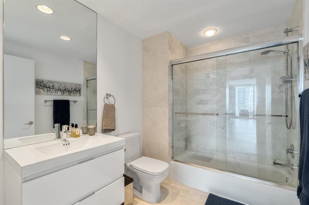 17111 Biscayne Boulevard, Unit 1101 North Miami Beach, FL 33160 - Photo 30 of 43 a bathroom with a sink toilet and shower