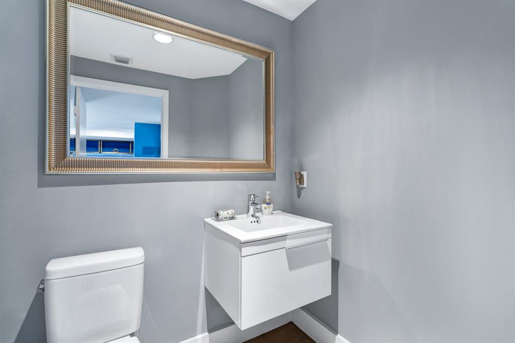 17111 Biscayne Boulevard, Unit 1101 North Miami Beach, FL 33160 - Photo 31 of 43 a bathroom with a sink and a toilet