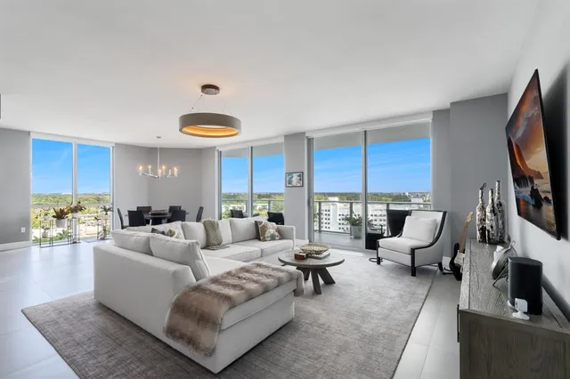 a living room with furniture or outdoor view and a large window