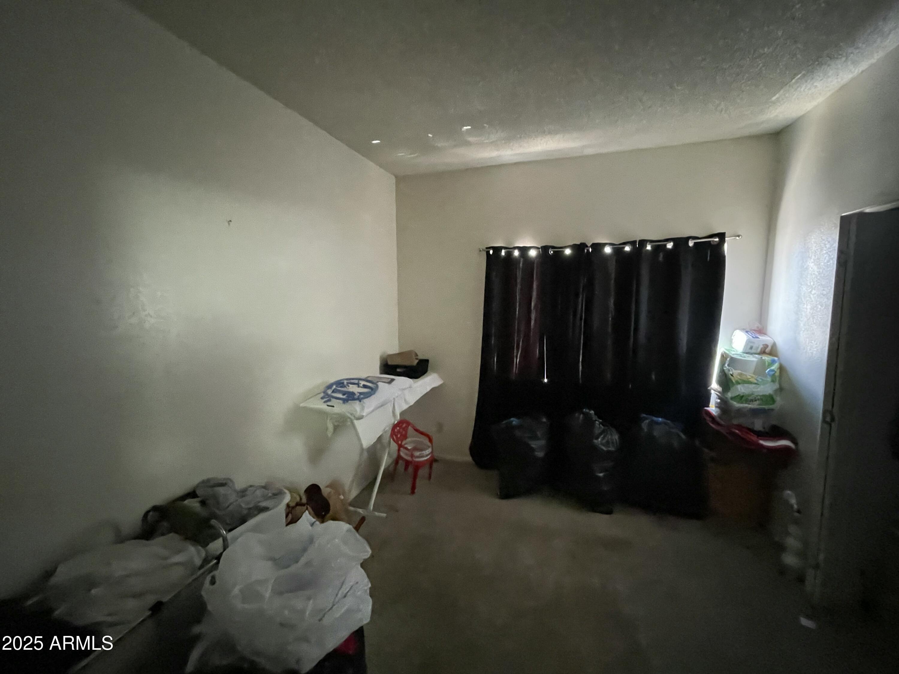 2813 East Monte Cristo Avenue Phoenix, AZ 85032 - Photo 21 of 26 a room with furniture and a gate