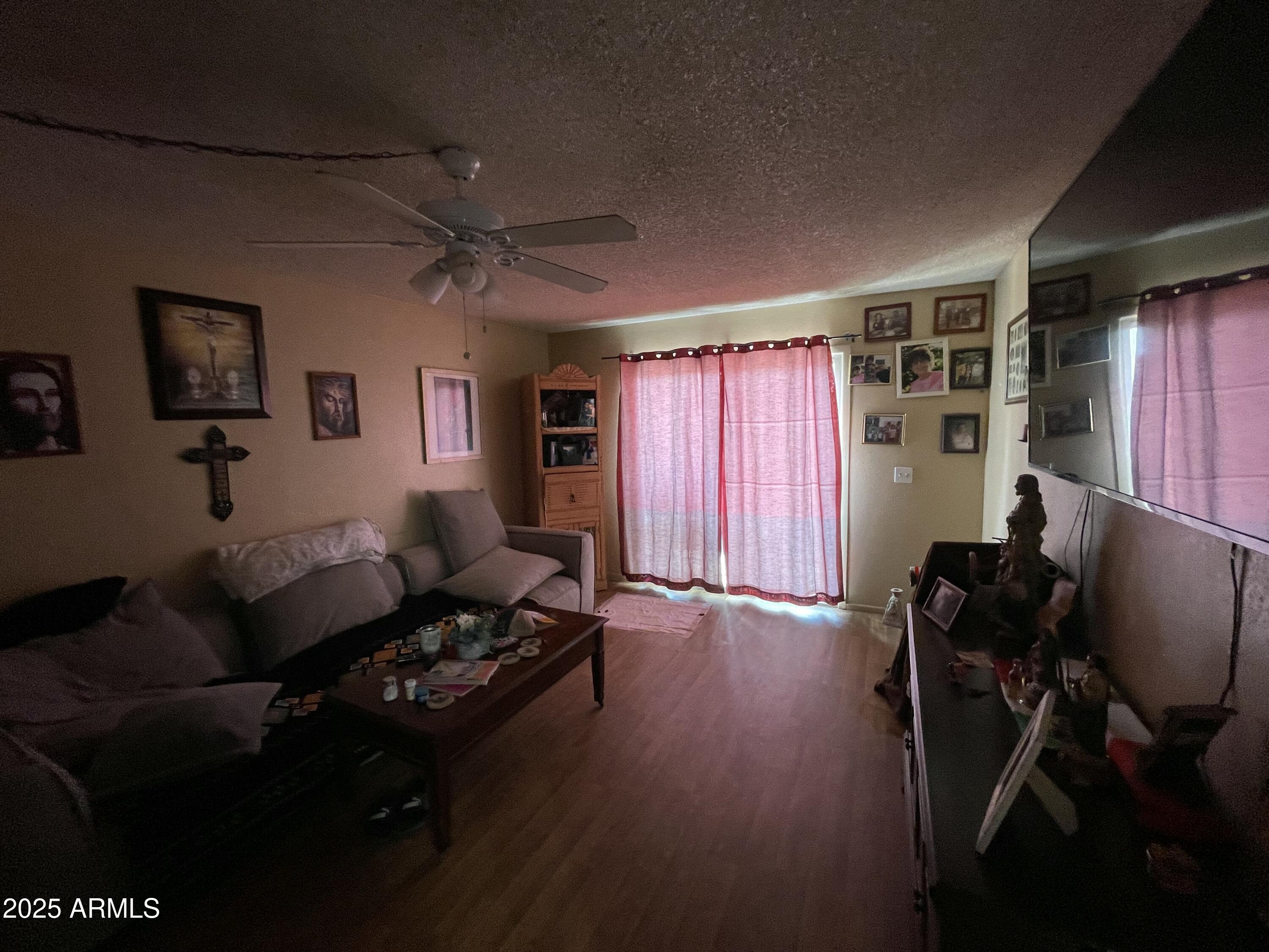 2813 East Monte Cristo Avenue Phoenix, AZ 85032 - Photo 8 of 26 a living room with furniture and a window