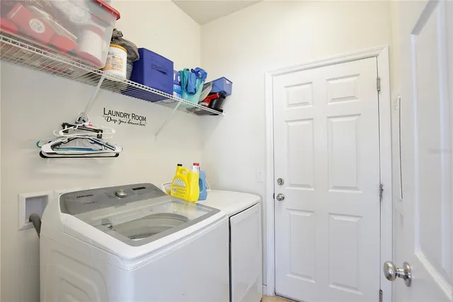 a utility room with dryer and washer