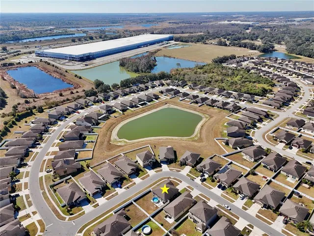 an aerial view of a pool patio and mountain view