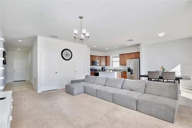 a living room with furniture and a table