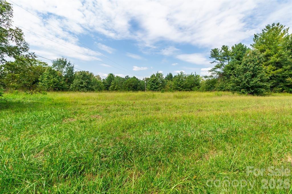 0 Putnam Lake Road Kings Mountain, NC 28086 - Photo 4 of 7 a view of field with trees in the background
