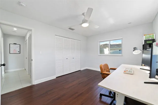a workspace with furniture and wooden floor
