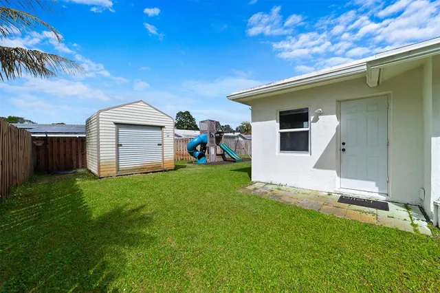 a view of a backyard with a barn