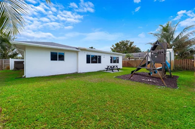 a view of a backyard with a garden and plants