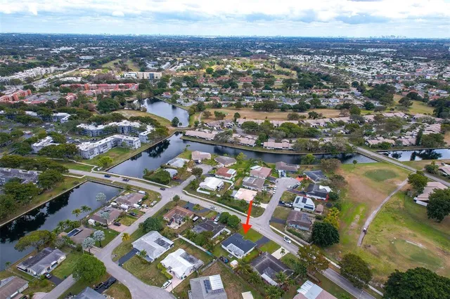 an aerial view of residential houses with outdoor space