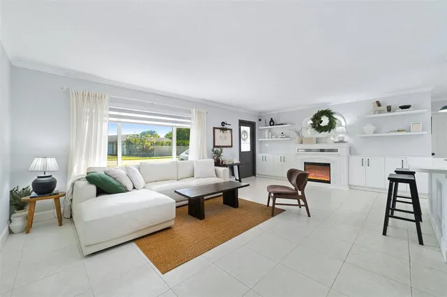 a living room with furniture and a window