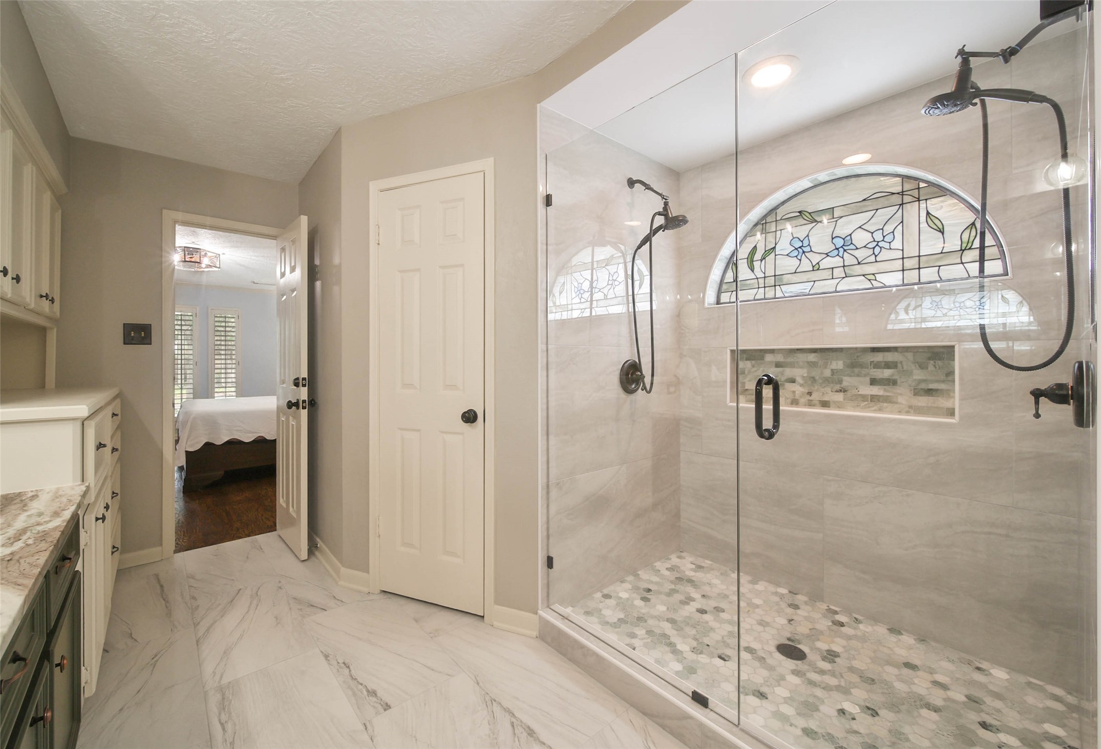 17007 Windrow Drive Spring, TX 77379 - Photo 24 of 46 a bathroom with a glass shower door and a sink