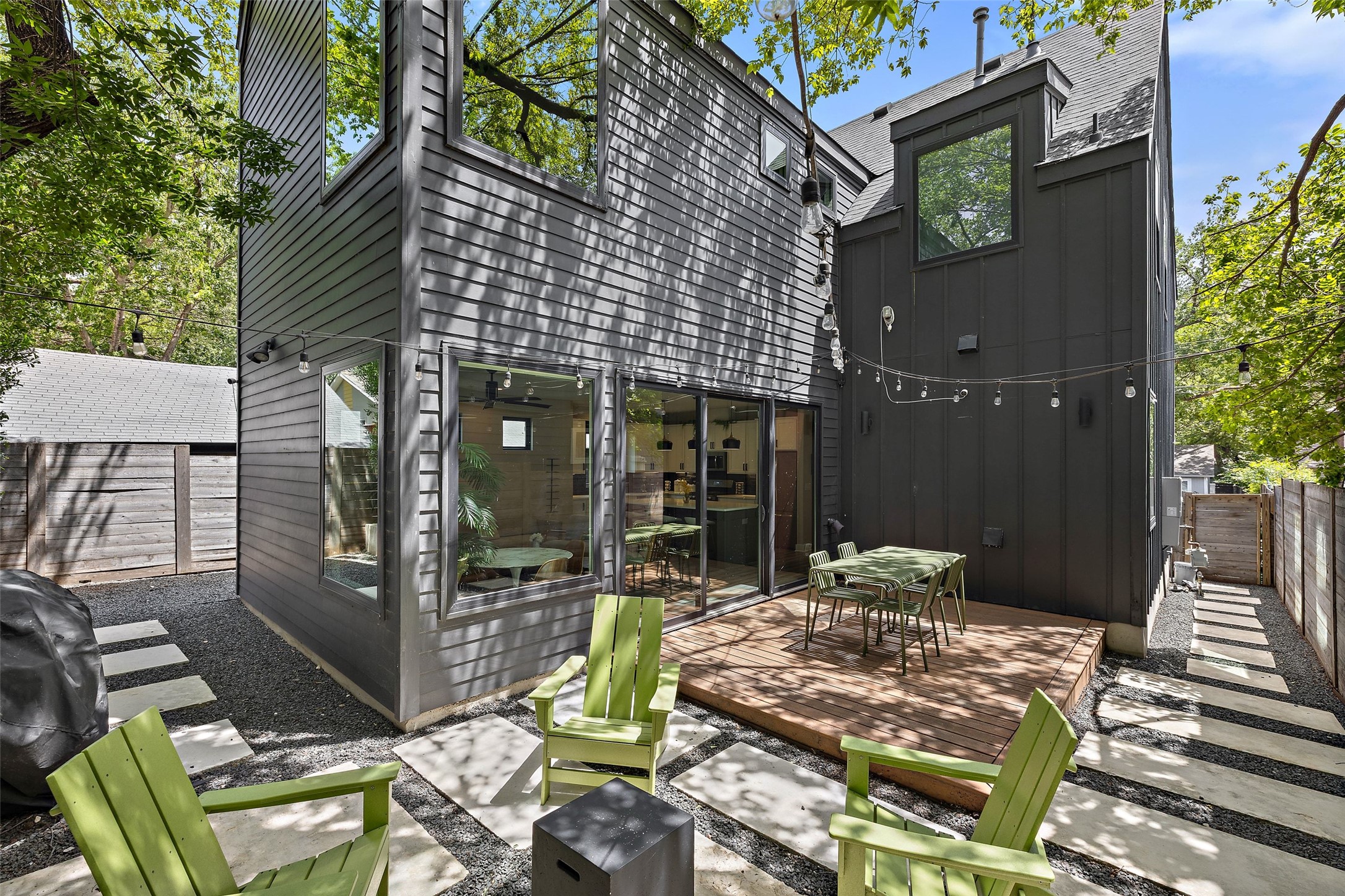 2202 Santa Rita Street Austin, TX 78702 - Photo 33 of 40 Private backyard with seating area, fire pit, and backyard deck