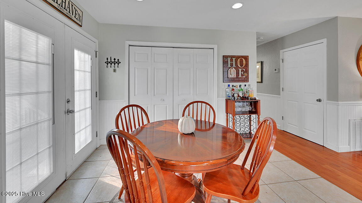 278 Woodstock Road Belhaven, NC 27810 - Photo 19 of 37 Dining area leads to back deck and hallway to bedrooms and baths.