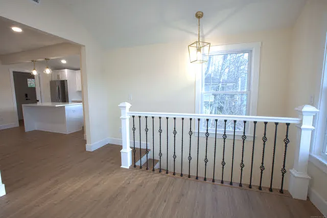 a view of entryway with wooden floor