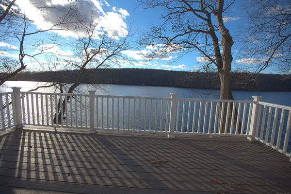 a view of deck with wooden floor and fence with wooden fence