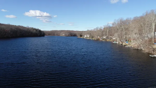 a view of an ocean and a houses
