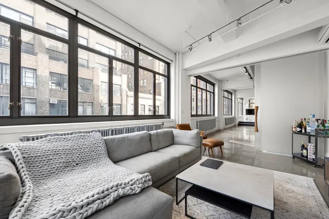 a room with gym equipment and a large window