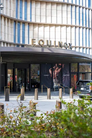 a stone house with a clock on the side of it