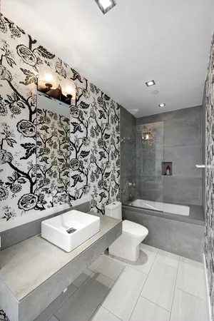 a large kitchen with kitchen island a refrigerator and a sink