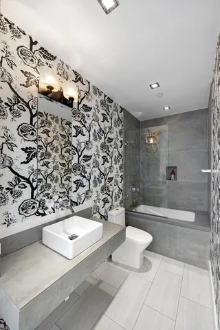 a large kitchen with kitchen island a refrigerator and a sink