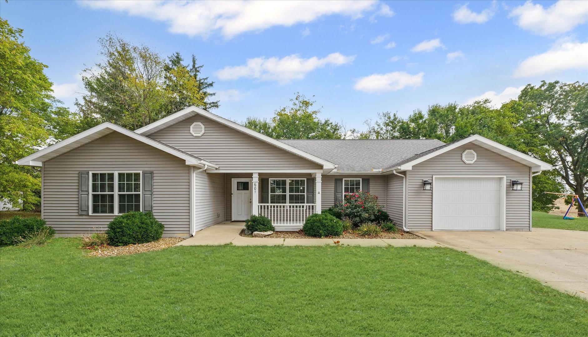 601 Curtis Road Ogden, IL 61859 - Photo 1 of 29 a view of a house with a yard and potted plants