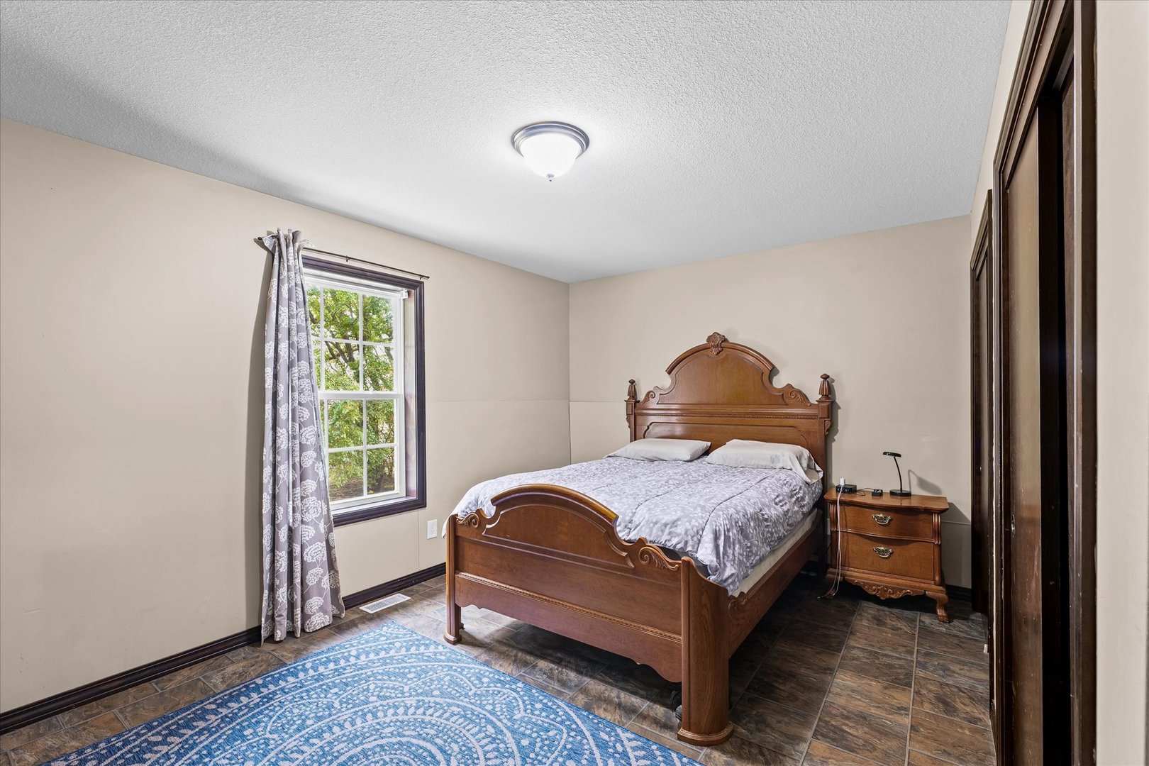 601 Curtis Road Ogden, IL 61859 - Photo 17 of 29 a bedroom with a bed and a window