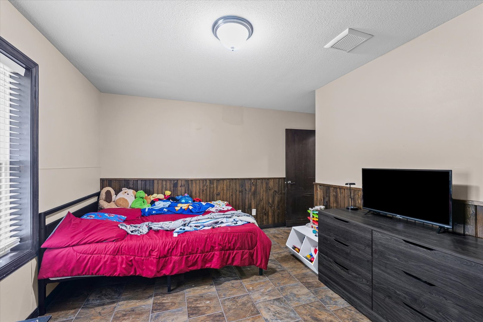 601 Curtis Road Ogden, IL 61859 - Photo 20 of 29 a bedroom with a bed and a flat screen tv