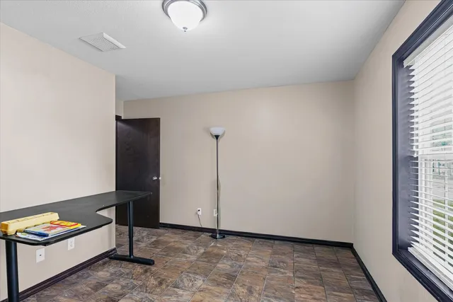 a view of an empty room and window