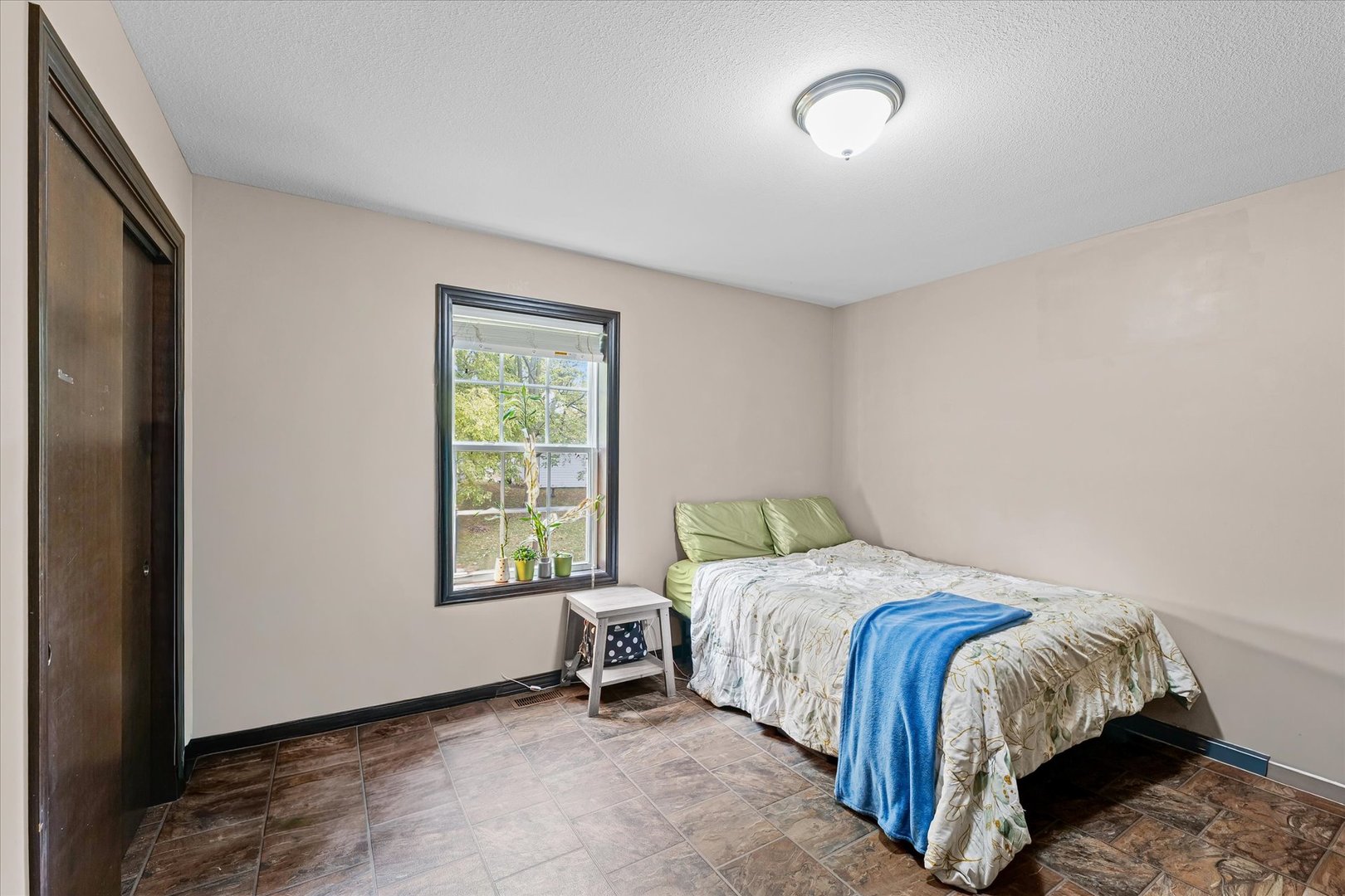 601 Curtis Road Ogden, IL 61859 - Photo 24 of 29 a bed sitting in a bedroom next to a window