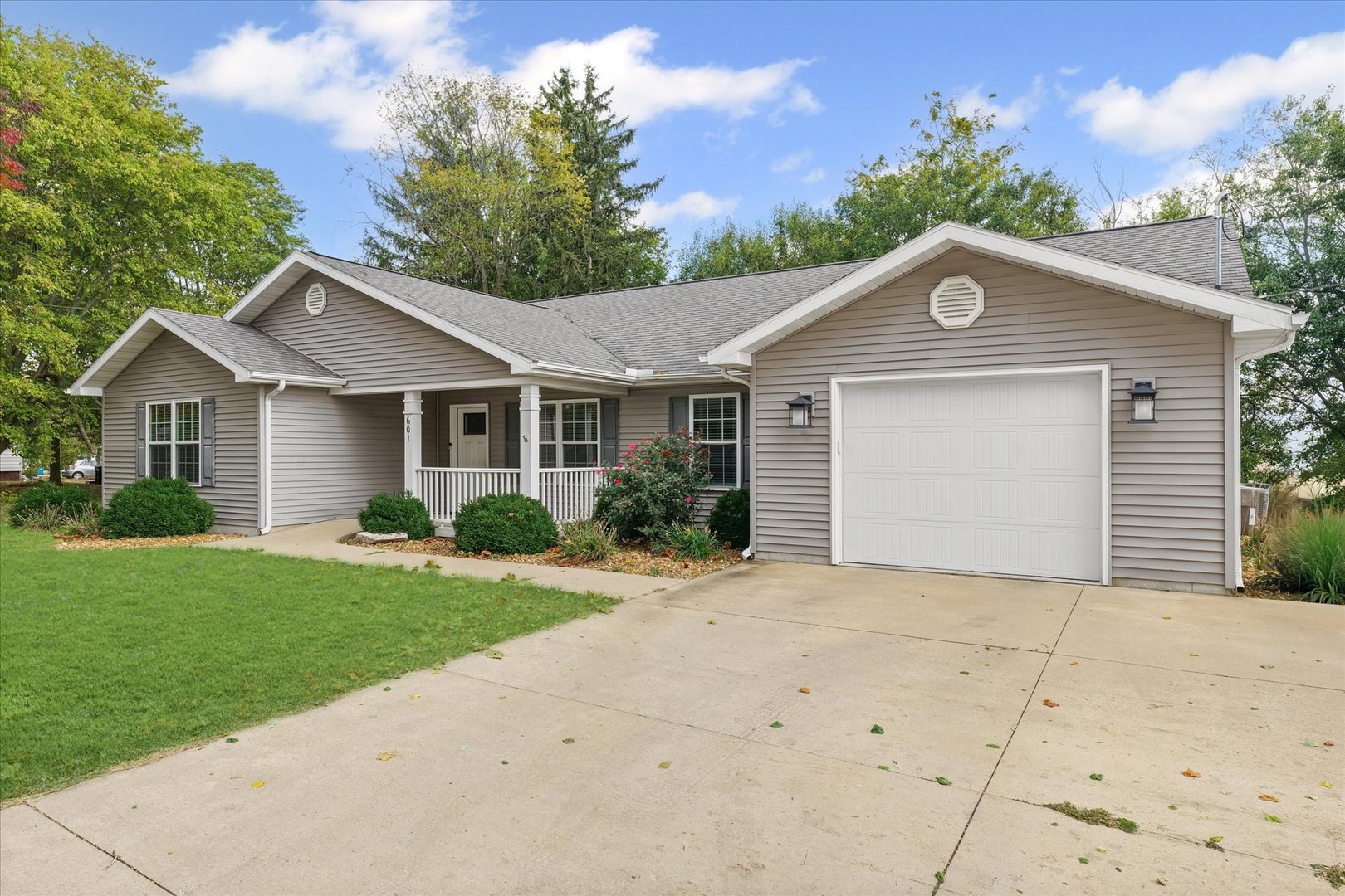601 Curtis Road Ogden, IL 61859 - Photo 3 of 29 a front view of a house with a garden and yard